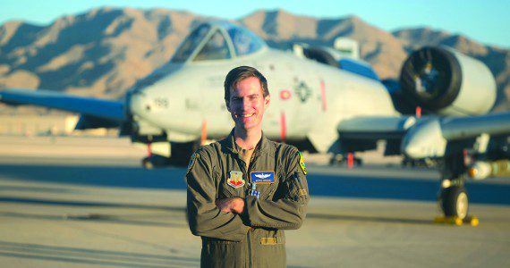 U.S. Air Force Major Kyle Adkison, A-10 Pilot assigned to the 53rd Wing is presented the Distinguished Flying Cross with Combat Service by U.S. Air Force Major General R. Scott Jobe, Director of Plans, Programs, and Requirements, Headquarters Air Combat Command, during a ceremony at Nellis Air Force Base, Nevada, Nov. 22, 2022.