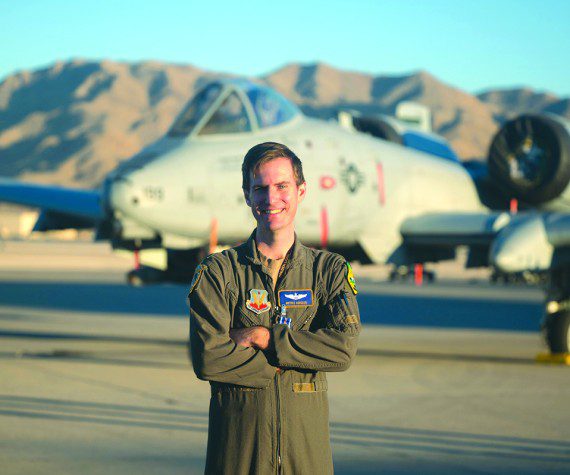 U.S. Air Force Major Kyle Adkison, A-10 Pilot assigned to the 53rd Wing is presented the Distinguished Flying Cross with Combat Service by U.S. Air Force Major General R. Scott Jobe, Director of Plans, Programs, and Requirements, Headquarters Air Combat Command, during a ceremony at Nellis Air Force Base, Nevada, Nov. 22, 2022.