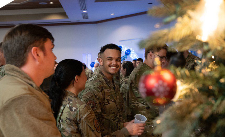 U.S. Air Force Airmen grab water during a Chief Master Sgt. select party in the Nellis Club at Nellis Air Force Base, Nevada, Dec. 7, 2023. This ceremony welcomes the new Chief Master Sgt. selects to step up and reach highest tier of the enlisted leadership structure. (U.S. Air Force photo by Airman 1st Class Timothy Perish)