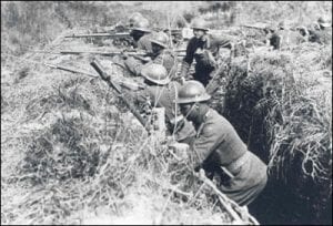 African-American Soldiers (and one of their white officers) of the 369th Infantry practice what they will soon experience