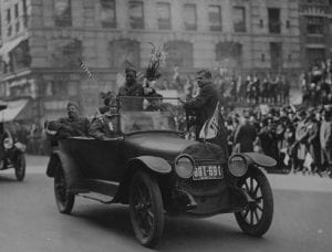 Sgt. Henry Johnson waves to well-wishers during the 369th Infantry Regiment march up Fifth Avenue in New York City