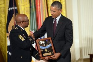 Command Sgt. Maj. Louis Wilson of the New York Army National Guard accepts the Medal of Honor on behalf of World War I Pvt. Henry Johnson