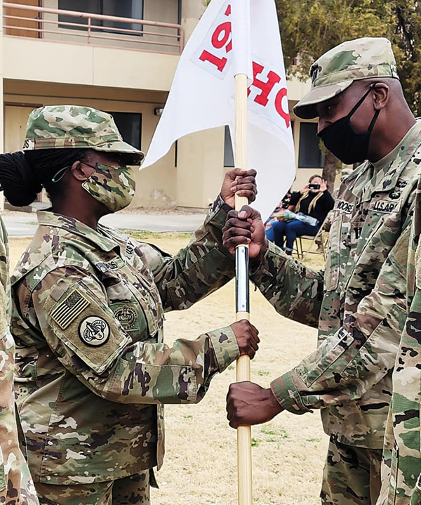 1SG Nicole Shields relinquishes her responsibility with HHC Commander, Capt. Johnathan Moore.