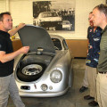 Photograph by Linda KC Reynolds Rod Emory (left) of Emory Motorsports shows Lt. Col Mark Massaro, Commander of the 412th Operations Support Squadron, how his team handcrafts rare Porsches and builds a 356 Outlaw class, combining the nostalgic look with the modern driveline and suspension. Emory’s team restored the 1949 Porsche Gmund SL 356/2 that won its class in the 1951 Le Mans. It is considered priceless and the most significant Porsche in the world.