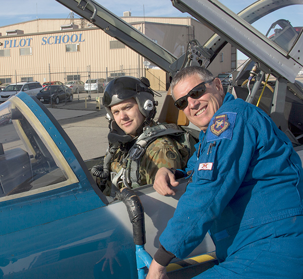 Photograph by Linda KC Reynolds Capt. Bart Gladysz of the Australian Army gets a lesson from Jim “JB” Brown, chief operations officer and test pilot instructor at the National Test Pilot School in Mojave. Gladysz completed the 12-month Professional Flight Test Engineer Program and graduated Dec. 15. NTPS is the first and only test pilot school certified to provide qualifying training for test pilots to earn their European Union Test Pilot rating.