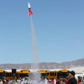 Photograph by Linda KC Reynolds Blue skies and excited children await the landing of their rocket during the Intermediate Space Challenge at Mojave Air and Space Port. Twenty-six rockets were launched before students enjoyed a picnic and bragging rights.
