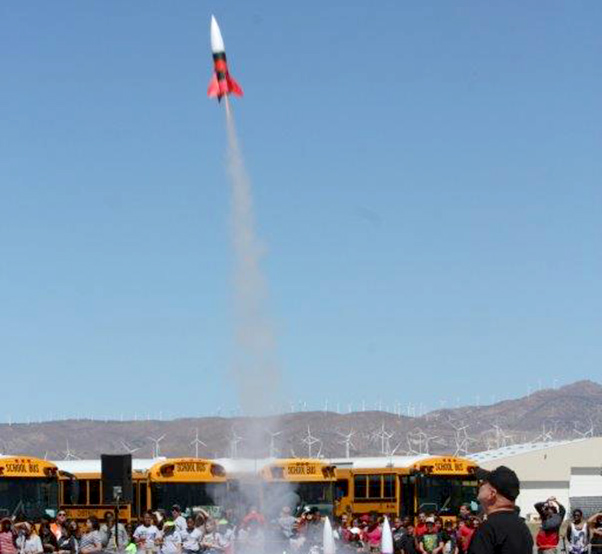 Photograph by Linda KC Reynolds Blue skies and excited children await the landing of their rocket during the Intermediate Space Challenge at Mojave Air and Space Port. Twenty-six rockets were launched before students enjoyed a picnic and bragging rights.