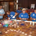 Photograph by Linda KC Reynolds Several hundred badges were made by aerospace workers for kids who will be attending the Painted Turtle Camp. Volunteering a few hours saves the camp staff hundreds of labor hours and is a very rewarding experience for all who volunteer.