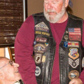Photograph by Linda KC Reynolds World War II Veteran Capt. Robert “Bomber Bob” Wood receives a “First Ride” coin from Patriot Guard Steve Blumenfield. Blumenfield said it was an honor, and a nice change, to escort veterans who are still alive.