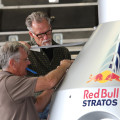 Photographs by Linda KC Reynolds Ready to launch — Art Thompson of A2zFX and Sage Cheshire works with Kent Burns placing final decals on a Red Bull Stratos capsule that will be shipped to the Sheikh Jaber Al Ahmad Cultural Centre in Kuwait. Thompson designed the original capsule and a flight suit for Red Bull where Felix Baumgartner broke the speed of sound reaching an estimated speed of 833.9 mph jumping from the stratosphere Oct. 14, 2012.