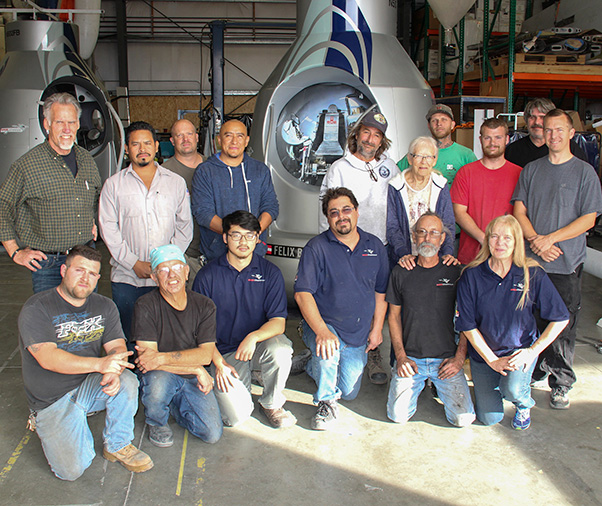 Photographs by Linda KC Reynolds The team — Employees of A2zFX and Sage Cheshire pose in front of three Red Bull Stratos Capsules, the newest will be shipped to Sheikh Jaber Al Ahmad Cultural Centre in Kuwait.