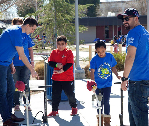Photograph by Linda KC Reynolds Lockheed Martin employees volunteer during the 32nd Annual Los Angeles County Science Olympiad, encouraging students to pursue STEM education. Nearly 2,000 students will participate at the 34th Annual National Competition in May at Colorado State University in Fort Collins, Colo.