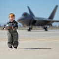 Photograph bb Linda KC Reynolds Who is that boy? Bryce Sanden, 4, is the grandson of Bob and Cathy Driver, both Lockheed Martin employees, who host the Photo Tour at the LA County Air Show at General William J. Fox Airfield. This photograph was taken during Family Day at Plant 42 and became an instant hit and is being used in print advertising and billboards. Bryce now sits alongside legends and autographs photos drawing a smiley face until he can master his penmanship.