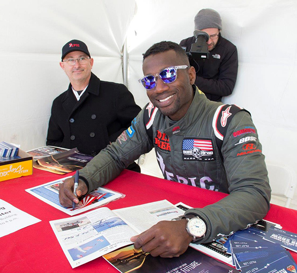 Photograph by Linda KC Reynolds Anthony Oshinuga signs autographs at the 5th Annual LA County Air Show after performing in his Pitts Special S-1. “Black Hawk.” The son of Nigerian immigrants, Oshinuga made history as the first African-American pilot to enter the Reno National Championship Air Race and earn a podium spot.