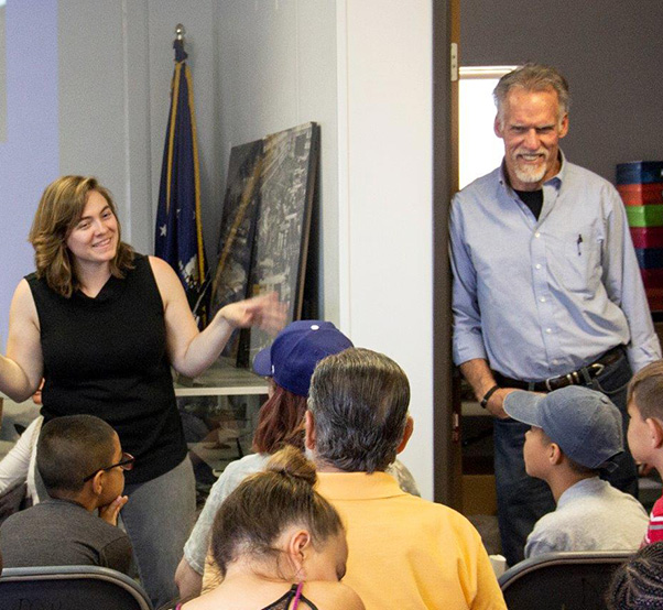 Photograph by Linda KC Reynolds Stephanie Creiger, an instructor at the Junior Test Pilot Program, introduces Art Thompson of Sage Cheshire. Thompson was the guest speaker for a lesson on stealth technology, during a free two-week summer camp at Blackbird Airpark. The program is running June 11-July 19, Monday through Thursday from 9 a.m.-12:30 p.m.