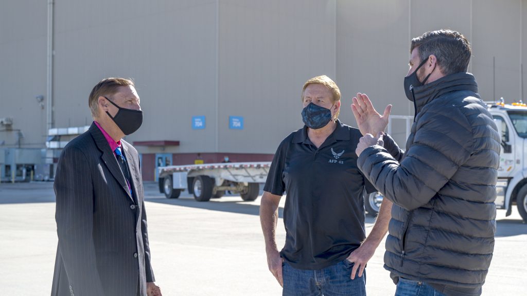 Dr. Roderick Davis, Air Force Plant 42 Deputy Director, and Ken Neitzel, Air Force Plant 42 Airfield Operations Director, talk with Edward Graham, Assistant to the Vice President of Programs and Government Relations for Samaritan’s Purse. (Air Force photo by Giancarlo Casem)