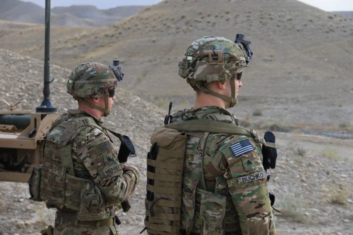 Security in Afghanistan Raider Brigade soldiers from 2nd Battalion, 23rd Infantry Regiment, 1st Stryker Brigade Combat Team, 4th Infantry Division, provide security near their armored vehicle in Afghanistan, September 21, 2018. Soldiers often provide security as coalition partners advise and train the Afghan National Army. Army photograph by Spec. Christopher Bouchard