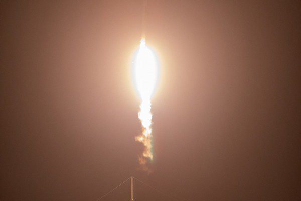 Dragon spacecraft, soars upward after lifting off