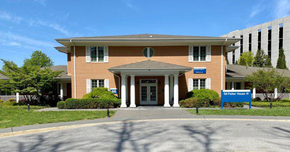 A typical, brick Fisher House stands on the campus of Walter Reed National Military Medical Center, April 29, 2022.