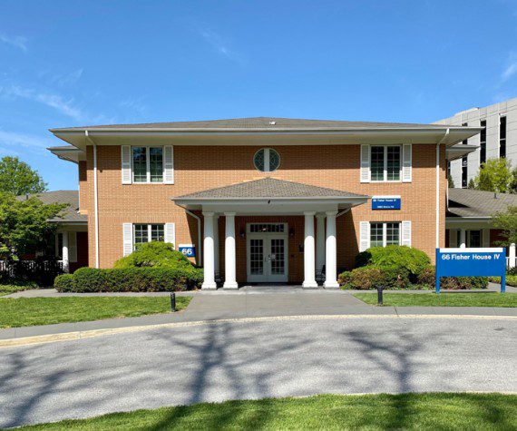 A typical, brick Fisher House stands on the campus of Walter Reed National Military Medical Center, April 29, 2022.