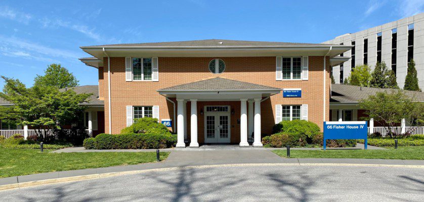 A typical, brick Fisher House stands on the campus of Walter Reed National Military Medical Center, April 29, 2022.