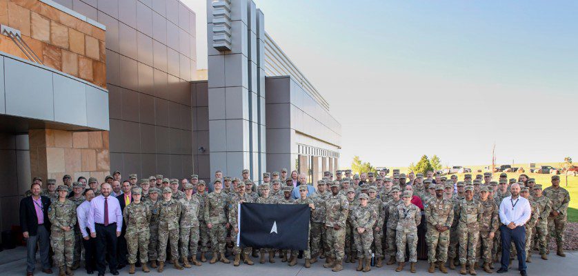 Space Flag 22-3 participants pose for a group photo at Schriever Space Force Base, Colo., Aug. 8, 2022. Space Flag 22-3, which ran from Aug. 8-19, was the largest iteration executed to date with approximately 120 participants from nearly a dozen U.S. Space Force Deltas, as well as members from the U.S. Air Force and the U.S. Army.