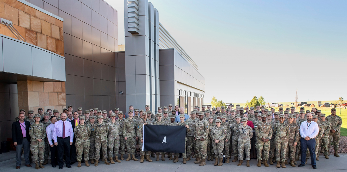 Space Flag 22-3 participants pose for a group photo at Schriever Space Force Base, Colo., Aug. 8, 2022. Space Flag 22-3, which ran from Aug. 8-19, was the largest iteration executed to date with approximately 120 participants from nearly a dozen U.S. Space Force Deltas, as well as members from the U.S. Air Force and the U.S. Army.