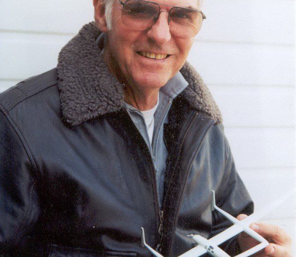 Dick Rutan holds a model of the Voyager aircraft. (Courtesy photograph)
