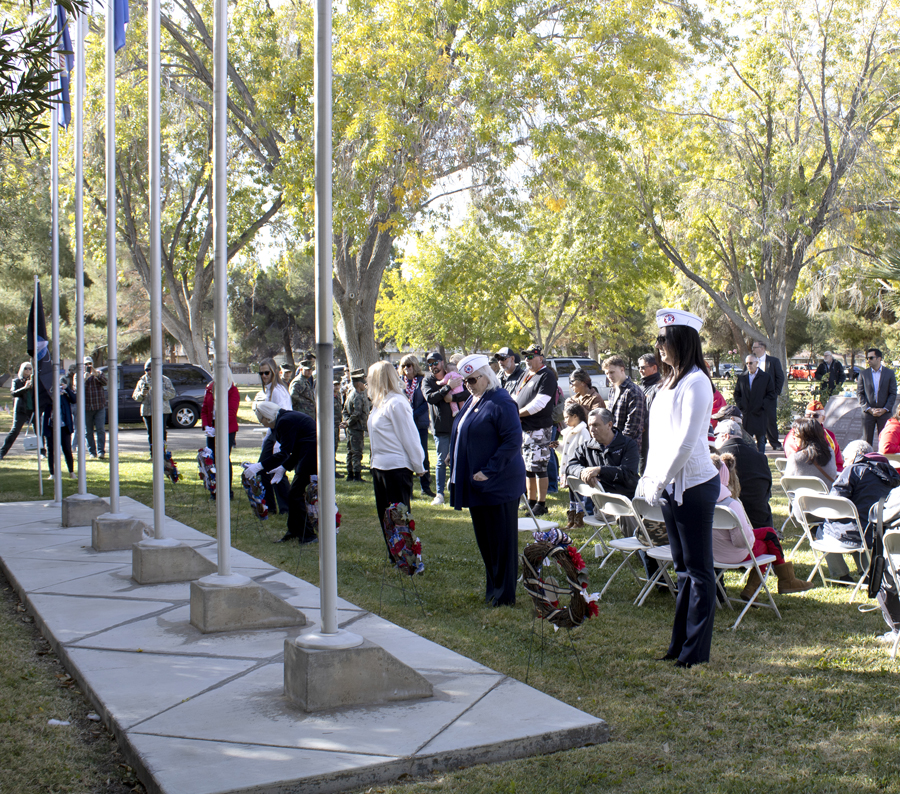 The Antelope Valley Blue Star Mothers place wreaths for each of the service branches at the Lancaster Cemetery Veterans Day remembrance ceremony, Nov. 11, 2022. (Photograph by Adrienne King)