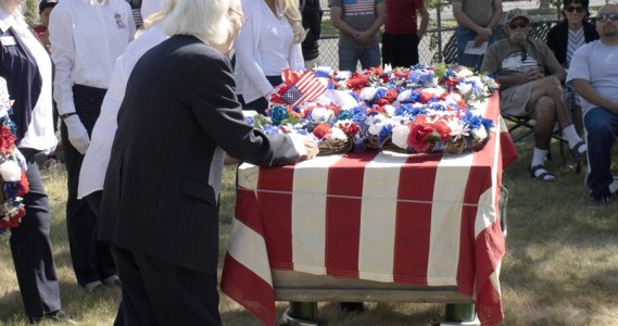Antelope Valley Blue Star Mothers place the military service wreaths on a memorial casket at the Lancaster Cemetery annual Memorial Day Remembrance Ceremony on May 29, 2023.