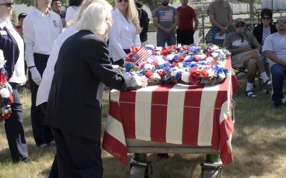Antelope Valley Blue Star Mothers place the military service wreaths on a memorial casket at the Lancaster Cemetery annual Memorial Day Remembrance Ceremony on May 29, 2023.