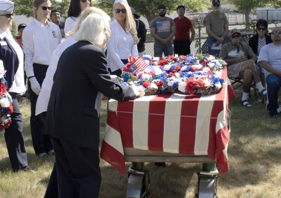 Antelope Valley Blue Star Mothers place the military service wreaths on a memorial casket at the Lancaster Cemetery annual Memorial Day Remembrance Ceremony on May 29, 2023.