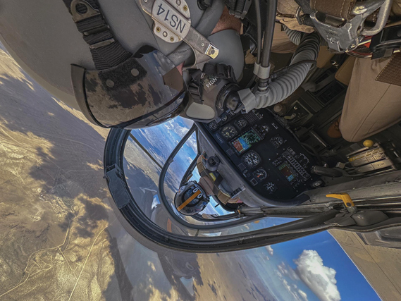 NASA research pilot Nils Larson and photographer Jim Ross complete aerobatic maneuvers in a NASA Armstrong Flight Research Center at Edwards, Calif., owned T-34C aircraft during a proficiency flight. (NASA photograph by Jim Ross)