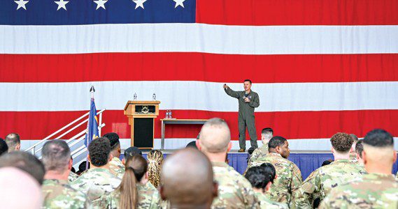 Colonel Todd “Riddler” Riddle, 944th Fighter Wing commander, addresses more than 600 Reserve Citizen Airmen during a commander’s call at Luke Air force Base, Ariz., Sept. 7, 2024. Riddle discussed the importance of preparedness, personal resources available to Airmen, and fostering connections within the unit to ensure mission success. (U.S. Air Force photo by Senior Airman Alexis Orozco)