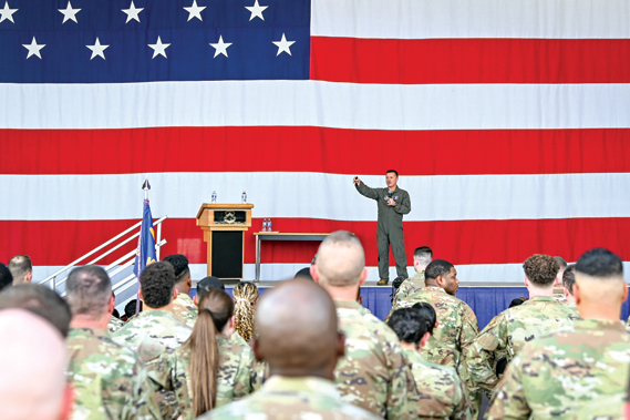 Colonel Todd “Riddler” Riddle, 944th Fighter Wing commander, addresses more than 600 Reserve Citizen Airmen during a commander’s call at Luke Air force Base, Ariz., Sept. 7, 2024. Riddle discussed the importance of preparedness, personal resources available to Airmen, and fostering connections within the unit to ensure mission success. (U.S. Air Force photo by Senior Airman Alexis Orozco)