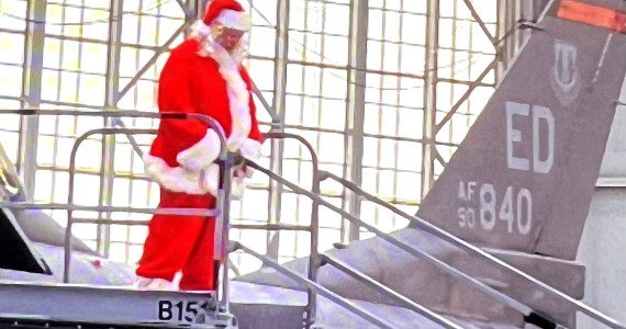 Santa arrives in F-16 (Courtesy photos Atherine Blanco Coffee4Vets)