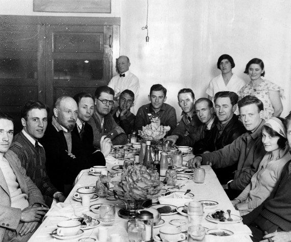 Aviator Charles Lindbergh (third from right) and pioneer aircraft builder Hawley Bowlus (fourth from right) join newsreel and print media photographers for a little party at the restaurant inside the Lebec Hotel after a day of glider flying near the Ridge Route. Aviators on the right, pressmen on the left. (Photograph by George Watson, courtesy of scvhistory.com)