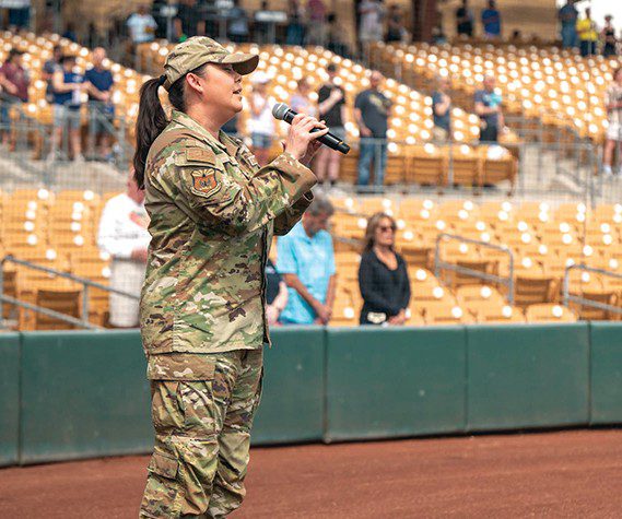 U.S. Air Force Master Sgt. Michelle Gagnon, 607th Air Control Squadron plans and programs flight chief, sings the National Anthem during the 2025 Military Appreciation game, Mar. 23, 2025 at the Camelback Ranch baseball complex, Glendale, Arizona.
