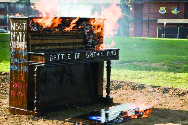 The piano burns at RAF Mildenhall. (Air Force photograph)