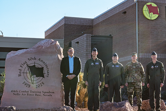 Acting Secretary of the U.S. Air Force Gary A. Ashworth, Maj. Gen. Christopher Niemi, USAF Warfare Center commander, Brig. Gen. Jesse Friedel, USAFWC deputy commander, Col. Jason Glynn, 99th Air Base Wing commander, and Col. Eric Winterbottom, 414th Combat Training Squadron commander, stand for a photo next to a commemorative stone for the 50th Anniversary of Red Flag at Nellis Air Force Base, Nev., April 4, 2025. Red Flag began in 1975 to address lessons learned in Vietnam, and celebrated 50 years of high-end training this year, highlighting Red Flag’s enduring legacy of preparing its participants to be combat-ready and mission-effective in the face of evolving threats. (Air Force photographs by Airman 1st Class Jennifer Nesbitt)
