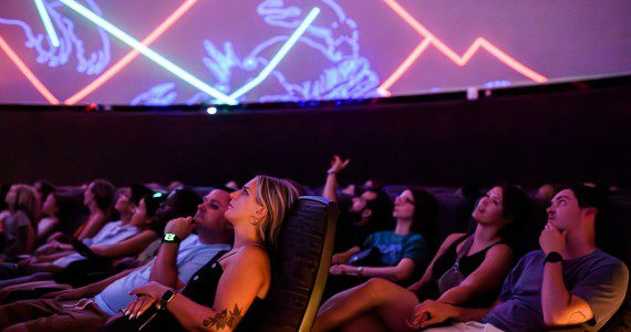 Visitors to the National Air and Space Museum in Washington, D.C., watch a planetarium show. The planetarium will be renamed the Northrop Grumman Planetarium after the company made a $10 million donation.