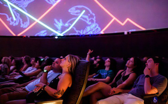 Visitors to the National Air and Space Museum in Washington, D.C., watch a planetarium show. The planetarium will be renamed the Northrop Grumman Planetarium after the company made a $10 million donation.
