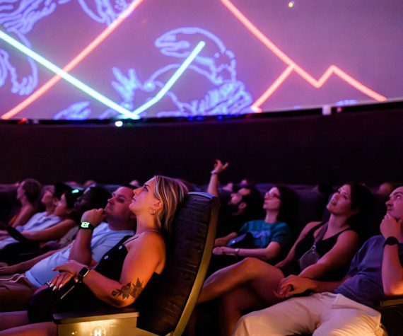 Visitors to the National Air and Space Museum in Washington, D.C., watch a planetarium show. The planetarium will be renamed the Northrop Grumman Planetarium after the company made a $10 million donation.