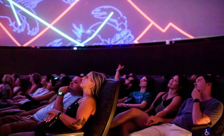 Visitors to the National Air and Space Museum in Washington, D.C., watch a planetarium show. The planetarium will be renamed the Northrop Grumman Planetarium after the company made a $10 million donation.