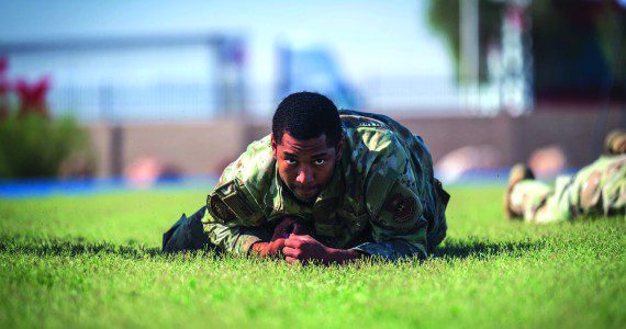 U.S. Air Force Airman 1st Class Jaylen Craig, 56th Security Forces Squadron defender, high crawls during the 2025 Police Week Defender Challenge, May 13, 2025, at Luke Air Force Base, Arizona. The Defender Challenge consists of various strength and endurance trials, including tire flips, casualty movements, and ammo can presses. The Defender Challenge is part of National Police Week, which honors the men and women of law enforcement agencies around the country, while remembering those who gave their lives in service. U.S. Air Force photos by Senior Airman Jakob Hambright
