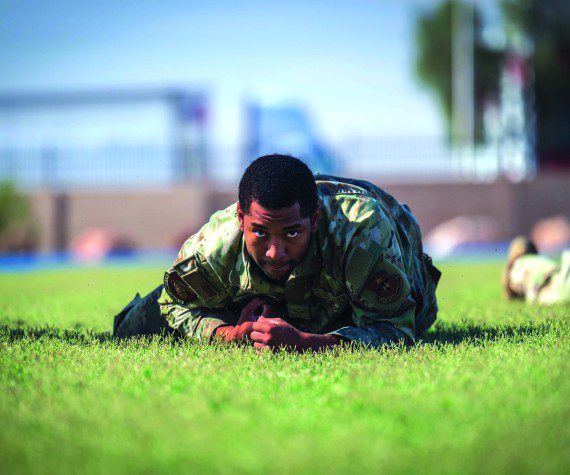 U.S. Air Force Airman 1st Class Jaylen Craig, 56th Security Forces Squadron defender, high crawls during the 2025 Police Week Defender Challenge, May 13, 2025, at Luke Air Force Base, Arizona. The Defender Challenge consists of various strength and endurance trials, including tire flips, casualty movements, and ammo can presses. The Defender Challenge is part of National Police Week, which honors the men and women of law enforcement agencies around the country, while remembering those who gave their lives in service. U.S. Air Force photos by Senior Airman Jakob Hambright
