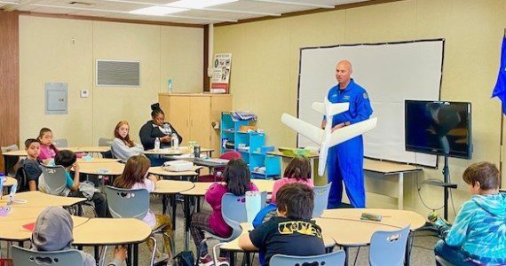 Brian Sandberg, former test pilot for Lockheed Martin, talks about his work and the principles of flight to a group of students in the Junior Flight Test Summer Program at Blackbird Air Park in Palmdale, Calif.