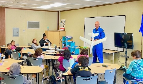 Brian Sandberg, former test pilot for Lockheed Martin, talks about his work and the principles of flight to a group of students in the Junior Flight Test Summer Program at Blackbird Air Park in Palmdale, Calif.