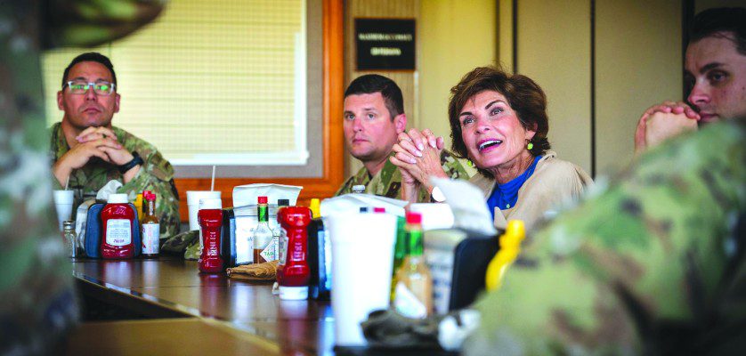 Janine Sijan-Rozina, Capt. Lance P. Sijan’s sister, speaks with U.S. Air Force Airmen assigned to the 56th Fighter Wing during a lunch event held in honor of her brother, Medal of Honor recipient Capt. Lance Sijan, May 16, 2025, at Falcon Dunes Golf Course, Luke Air Force Base, Arizona. Capt. Lance Sijan died while being held as a prisoner of war during the Vietnam War, and he is the first Air Force Academy graduate to receive the Congressional Medal of Honor. His sister, Janine, frequently visits Air Force installations to retell the story of her brother’s heroism and sacrifice. (U.S. Air Force photos by Senior Airman Jakob Hambright)