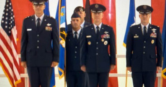 The 412th Test Wing change of command saw Brig. Gen. Douglas P. Wickert, center, command to his successor, Col. Thomas M. Tauer, right. Presiding over there ceremony was Maj. Gen. Scott A. Cain, commander of the Air Force Test Center. The ceremony was held at Edwards AFB, Calif., July 29, 2025. (Air Force photograph)